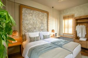 Postel nebo postele na pokoji v ubytování Casbah Boutique Hotel