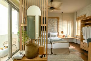 Postel nebo postele na pokoji v ubytování Casbah Boutique Hotel