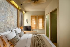 Postel nebo postele na pokoji v ubytování Casbah Boutique Hotel