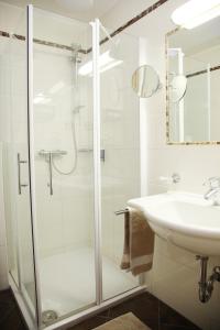 a bathroom with a shower and a sink at Tinschert Hotel-Restaurant-Partyservice in Schwertberg