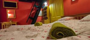 a bedroom with a bed with a green comforter at Ráday Street Apartment Budapest in Budapest