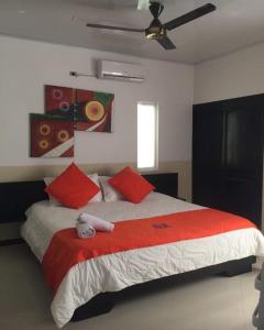 Postel nebo postele na pokoji v ubytování HOTEL CAMPESTRE SANTORINI