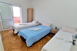 Cama ou camas em um quarto em Apartmani Gogić