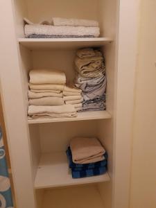 a closet filled with lots of folded towels at Seaview Villa at Stonebrook Manor in Falmouth