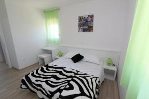 Postel nebo postele na pokoji v ubytování Villa Tamarut