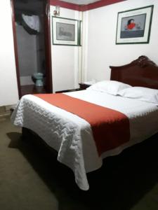 Postel nebo postele na pokoji v ubytování Hotel Tungurahua