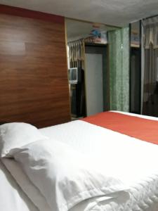 Postel nebo postele na pokoji v ubytování Hotel Tungurahua