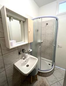 a bathroom with a sink and a shower at Apartment Marija in Vodnjan