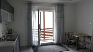 A kitchen or kitchenette at Apartmán u Braňa