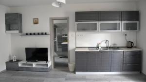 A kitchen or kitchenette at Apartmán u Braňa