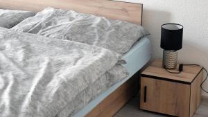 A bed or beds in a room at Apartmán u Braňa