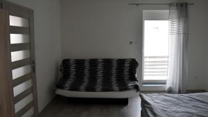 A bed or beds in a room at Apartmán u Braňa