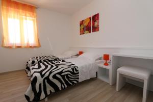 Postel nebo postele na pokoji v ubytování Villa Tamarut