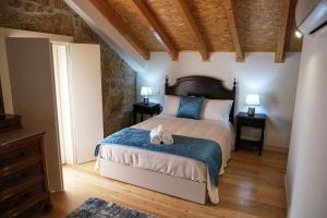 Ένα ή περισσότερα κρεβάτια σε δωμάτιο στο Aldeia da Quinta do Paço +177 φωτογραφίες