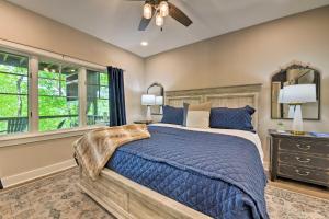a bedroom with a bed and a ceiling fan at Cashiers Getaway with Decks and Golf Course Views in Cashiers +37 photos