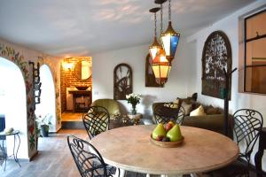 a living room with a table with fruit on it at Casa Pueblo 4 Bedroom in Todos Santos