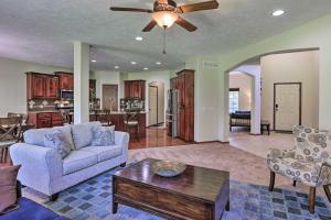 a living room with a couch and a table at Spacious Omaha Home with Expansive Yard and Patio in Omaha