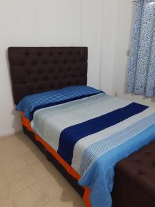 Łóżko lub łóżka w pokoju w obiekcie CASA CERCA DE LA PLAYA