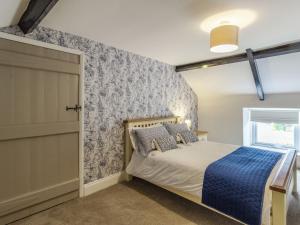 Кровать или кровати в номере Seabreeze Cottage