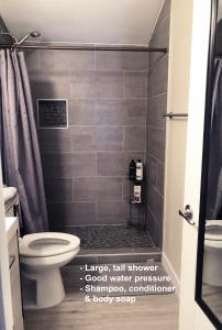 a bathroom with a toilet and a shower at Tempe ASU Guest Suite in Tempe