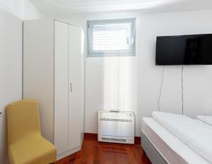 Televízia a/alebo spoločenská miestnosť v ubytovaní Apartmant Split Centar Soleo
