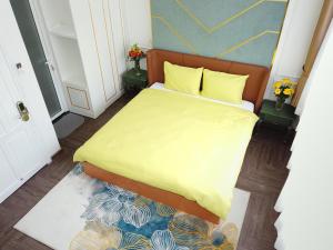 Postel nebo postele na pokoji v ubytování Free Style Hotel Dalat