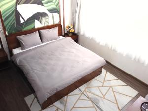 Postel nebo postele na pokoji v ubytování Free Style Hotel Dalat