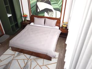Postel nebo postele na pokoji v ubytování Free Style Hotel Dalat