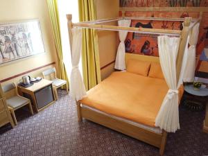 Postel nebo postele na pokoji v ubytování Free Style Hotel Dalat