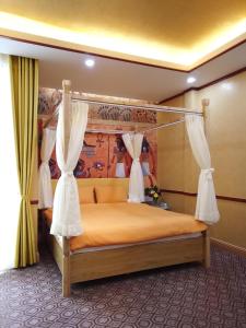 Postel nebo postele na pokoji v ubytování Free Style Hotel Dalat