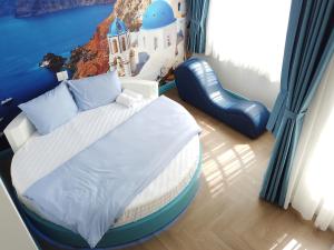 Postel nebo postele na pokoji v ubytování Free Style Hotel Dalat