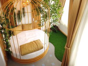 Postel nebo postele na pokoji v ubytování Free Style Hotel Dalat