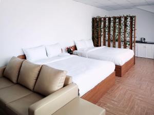 Postel nebo postele na pokoji v ubytování Free Style Hotel Dalat