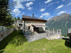 a house with a view of a mountain at CHALET ARMONIOSO in Leontica