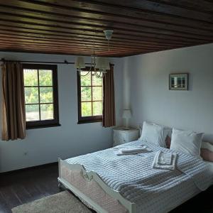 
a bedroom with a bed and a window at HiStory INN Unique Guest House in Veliko Tŭrnovo

