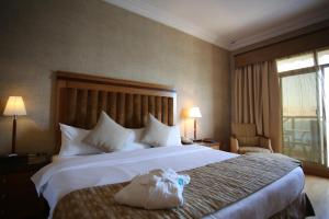 Voodi või voodid majutusasutuse Atana Khasab Hotel toas