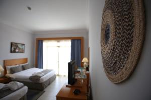 Voodi või voodid majutusasutuse Atana Khasab Hotel toas