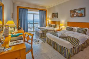 Voodi või voodid majutusasutuse Atana Khasab Hotel toas