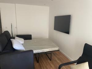 Televízia a/alebo spoločenská miestnosť v ubytovaní Cosy Sunrise Beach