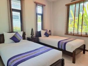 Postel nebo postele na pokoji v ubytování BAAN DALAH POOL VILLA + 22 fotografií