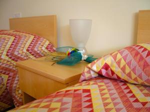 Postel nebo postele na pokoji v ubytování B&B & Residence Pozzo Misseo