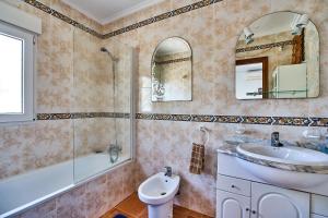a bathroom with a sink and a tub and a toilet at Espanhouse Villa in Ciudad Quesada for 4 in Ciudad Quesada +29 photos