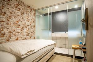 A bed or beds in a room at The Cole Hotel