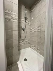 a bathroom with a shower with a drain at Terra Ciociara BnB in Frosinone +39 photos
