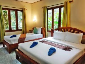 Ein Bett oder Betten in einem Zimmer der Unterkunft Tree Tops River Huts