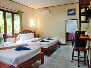 Ein Bett oder Betten in einem Zimmer der Unterkunft Tree Tops River Huts