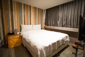 A bed or beds in a room at The Cole Hotel