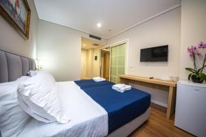 CLASS Hotel 객실 침대