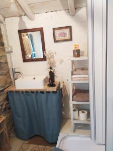 a bathroom with a sink and a mirror at Casa Lisa Guest rooms in Bibbiena