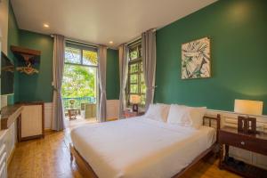 Кровать или кровати в номере Thi Boutique Villa